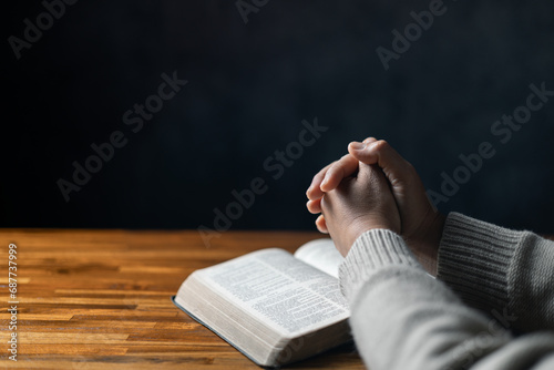 Christian life crisis prayer to god. Woman Pray for god blessing to wishing have a better life. woman hands praying to god with the bible. begging for forgiveness and believe in goodness.