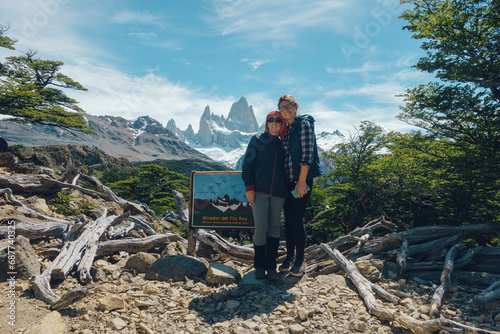 two girls posing, fitroy mountain in the back photo