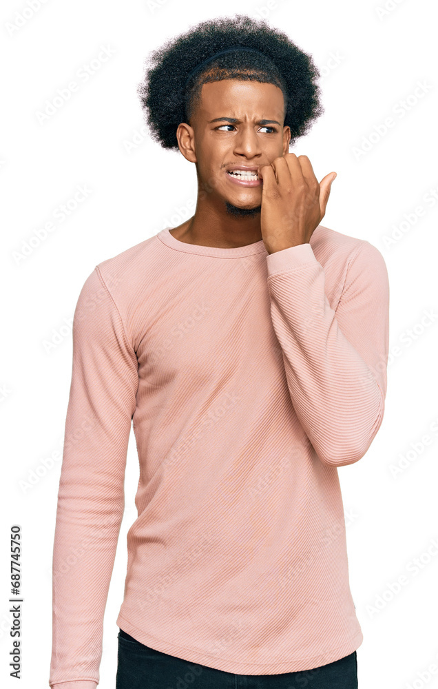African american man with afro hair wearing casual clothes looking stressed and nervous with hands on mouth biting nails. anxiety problem. African american man with afro hair wearing casual clothes looking stressed and nervous with hands on mouth biting nails. anxiety problem.