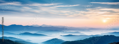 Amazing mountain landscape  banner with colorful vivid sunset travel background. Amazing nature scenery mountains under mist in the morning. Sunrise, sunset over the mountains  © Mrt