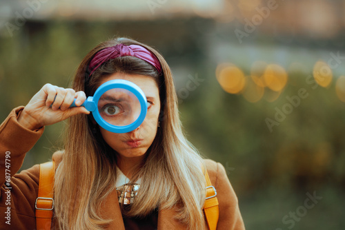 Vászonkép Funny Curious Woman Looking Through a Magnifying Glass