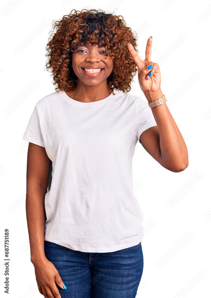 Young african american woman wearing casual white tshirt showing and pointing up with fingers number two while smiling confident and happy. Young african american woman wearing casual white tshirt showing and pointing up with fingers number two while smiling confident and happy.