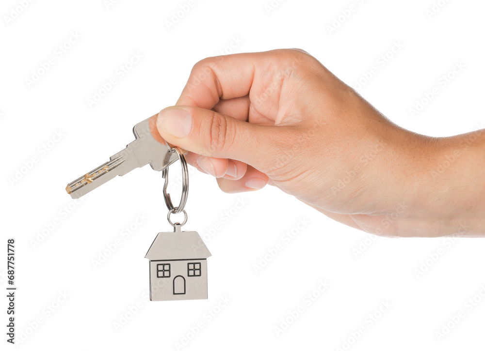 Woman holding key with metallic keychain in shape of house on white background, closeup Woman holding key with metallic keychain in shape of house on white background, closeup