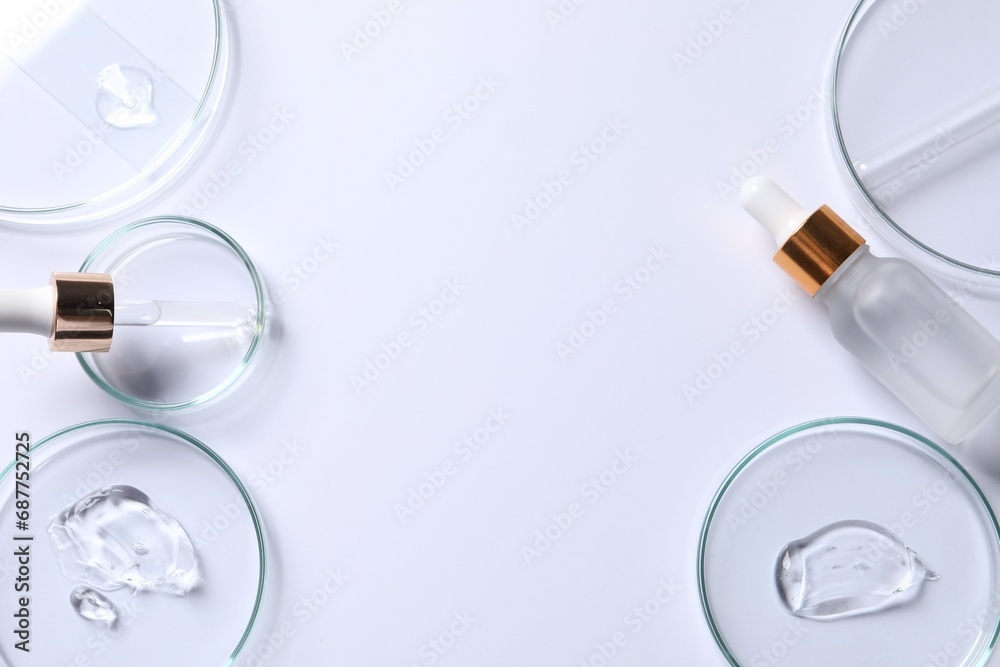 Petri dishes with samples of cosmetic serums, pipette and bottle on white background, flat lay. Space for text