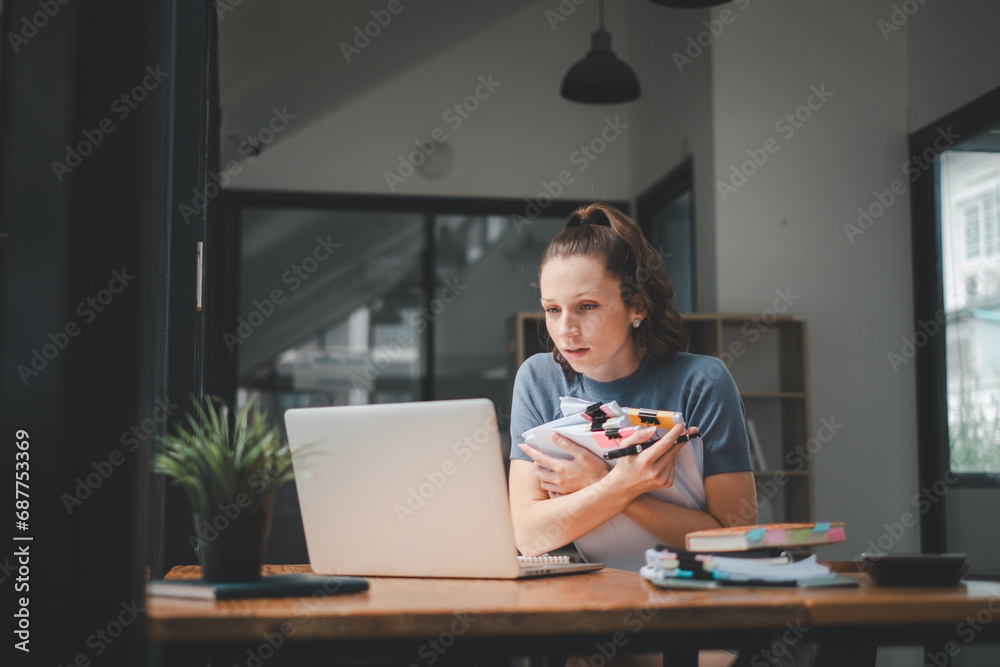 Business woman using business paper for doing math finance on office desk, tax, report, accounting, statistics, and analytical research concept Business woman using business paper for doing math finance on office desk, tax, report, accounting, statistics, and analytical research concept
