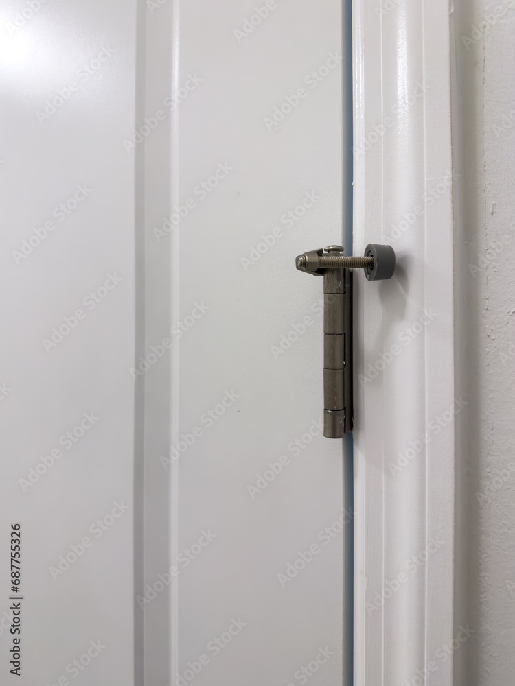 This door stopper mounts on the hinge pin of the door This door stopper mounts on the hinge pin of the door