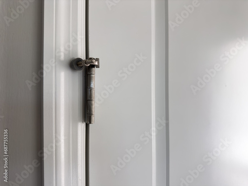 This door stopper mounts on the hinge pin of the door