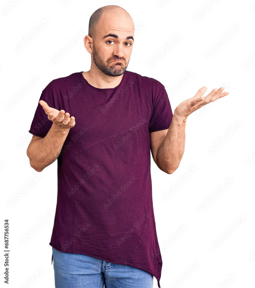 Young handsome man wearing casual t shirt clueless and confused expression with arms and hands raised. doubt concept. Young handsome man wearing casual t shirt clueless and confused expression with arms and hands raised. doubt concept.