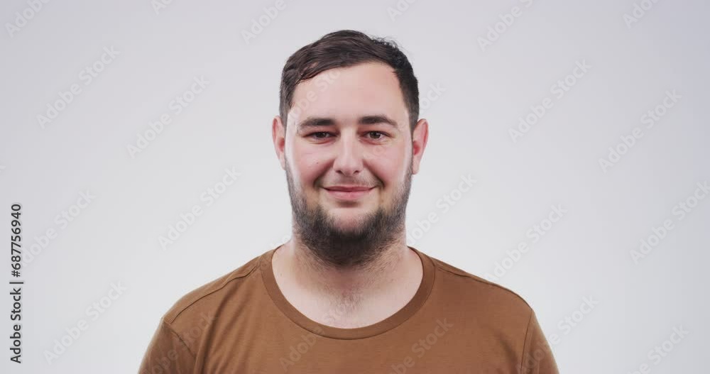 Smile, young and face of a man on a white background to relax with comedy or funny with mockup. Happy, laughing and portrait of a person on a backdrop for comic expression and emotion with space