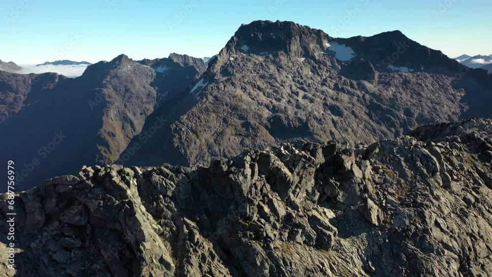 Stunning aerial flying over a rocky ridge in the mountains of New Zealand. Stunning aerial flying over a rocky ridge in the mountains of New Zealand.