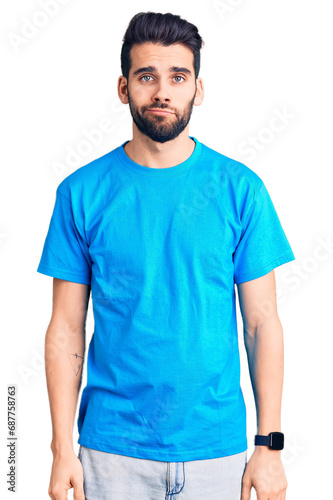 Wallpaper Mural Young handsome man with beard wearing casual t-shirt looking sleepy and tired, exhausted for fatigue and hangover, lazy eyes in the morning. Torontodigital.ca