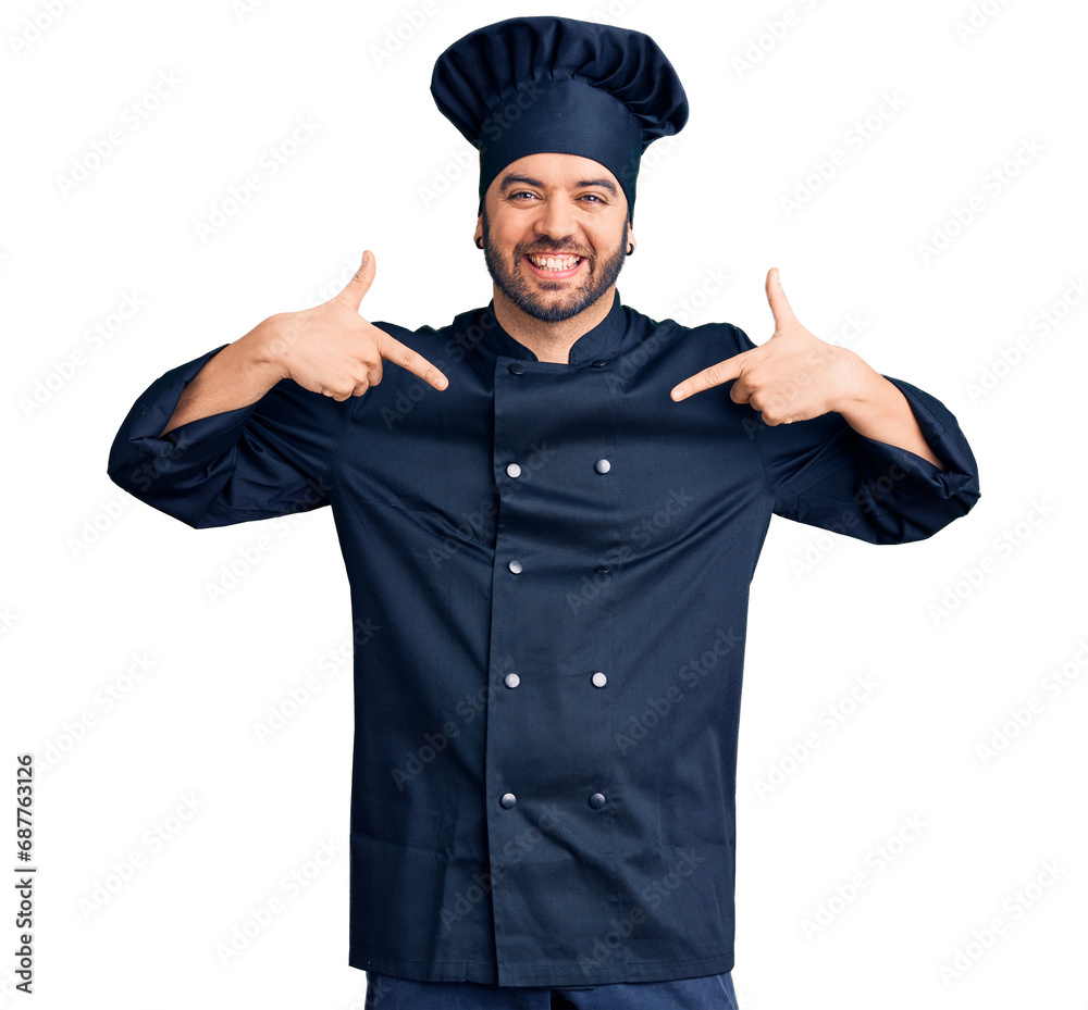 Young hispanic man wearing cooker uniform looking confident with smile on face, pointing oneself with fingers proud and happy. Young hispanic man wearing cooker uniform looking confident with smile on face, pointing oneself with fingers proud and happy.