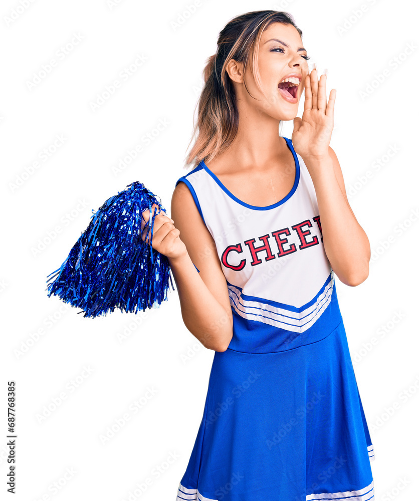 Young beautiful woman wearing cheerleader uniform shouting and screaming loud to side with hand on mouth. communication concept. Young beautiful woman wearing cheerleader uniform shouting and screaming loud to side with hand on mouth. communication concept.
