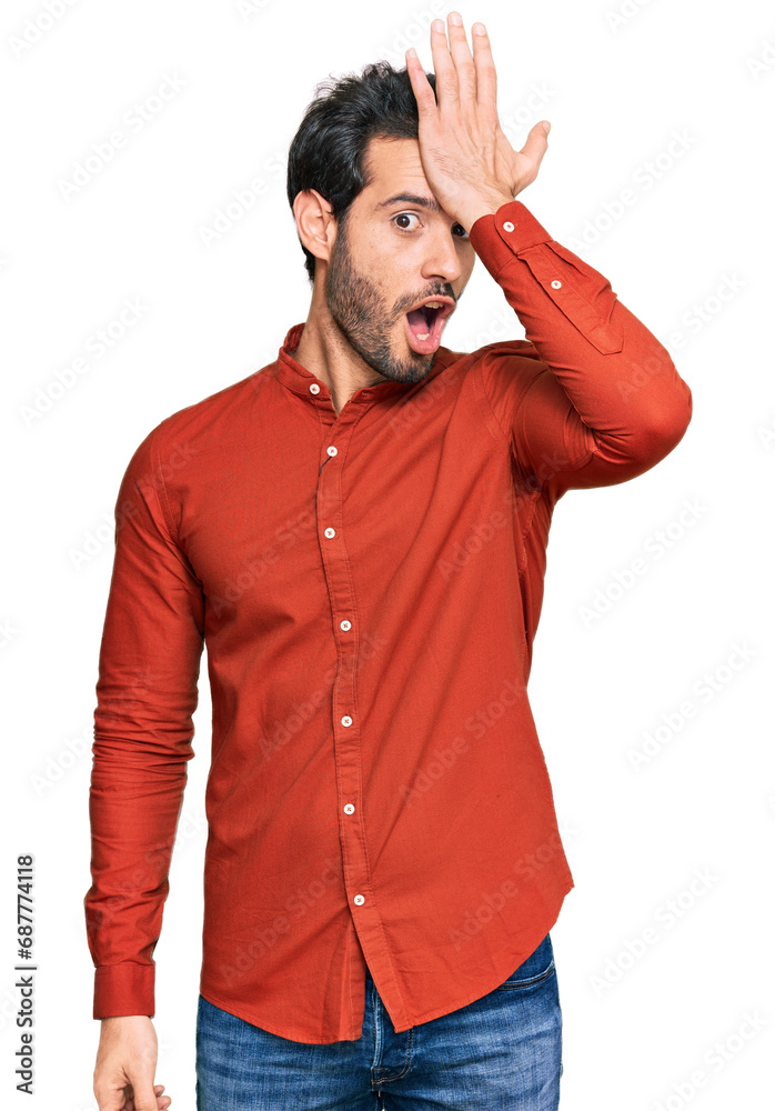 Young hispanic man wearing casual clothes surprised with hand on head for mistake, remember error. forgot, bad memory concept. Young hispanic man wearing casual clothes surprised with hand on head for mistake, remember error. forgot, bad memory concept.