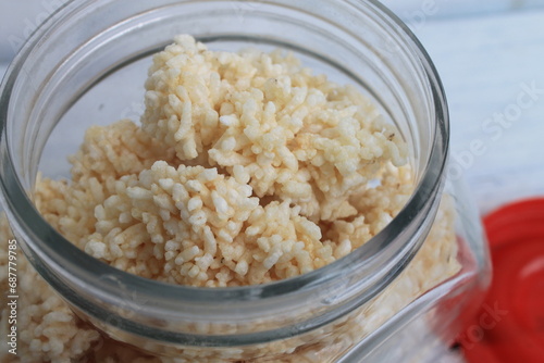 Indonesian snack called rengginang in a jar on the table photo