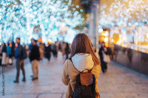 Canvas Print Traveler with bag visiting Roppongi Hills Christmas Illumination during winter season, happy tourist woman stands on a christmas market in Tokyo, Japan