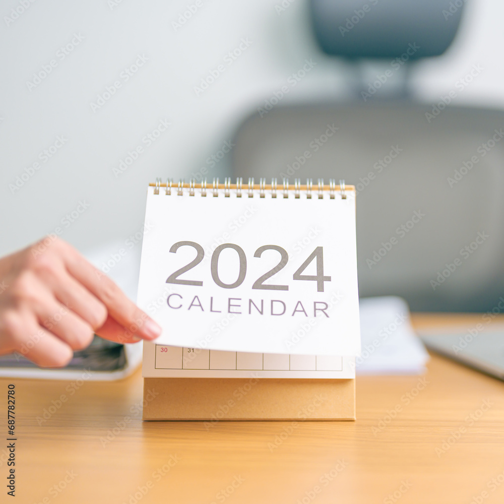 2024 Year Calendar on table background. countdown, Happy New Year, Resolution, Goals, Plan, Action, Mission and financial Concept 2024 Year Calendar on table background. countdown, Happy New Year, Resolution, Goals, Plan, Action, Mission and financial Concept