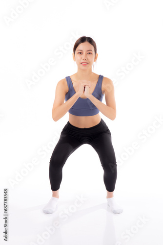 Full length portrait beautiful young asian woman in sportswear practicing doing squats for bodybuilder isolated white background, woman workout for strong and strength, sport and endurance concept. © N_studio