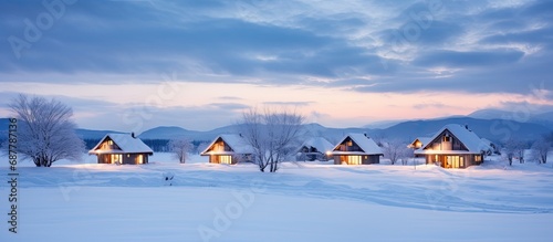 Furano winter cabins in Japan, during twilight. photo