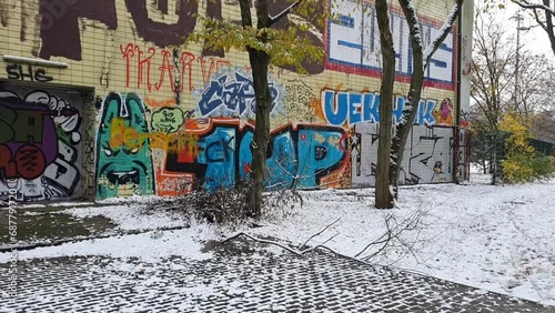 Pan to the right then pan downon a graffiti on a wall in Berlin HD 30 FPS 6 secs photo