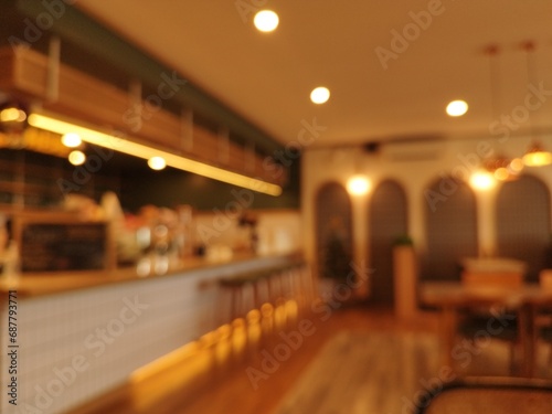 a blurry interior of a restaurant room