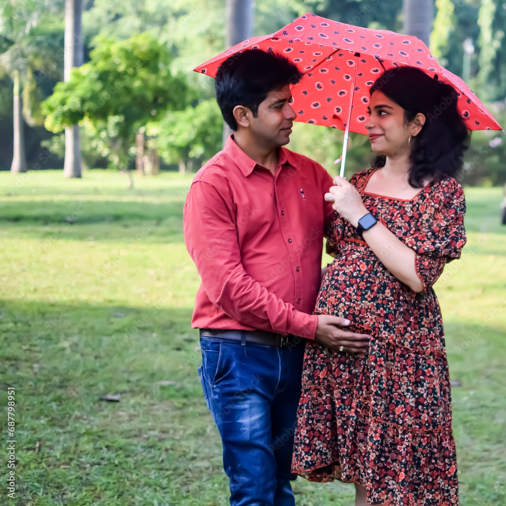 Indian couple posing for Maternity shoot pose for welcoming new born ...