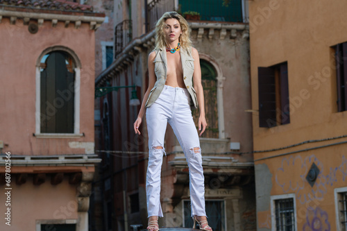 Fashion model. Attractive Fashion woman posing with slim sexy body on Italian street. Beautiful Fashion sexy model outdoor portrait. Beauty woman face. Attractive sensual girl, sexy fashion style.