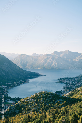 View from a green wooded mountain to the Bay of Kotor  surrounded by mountains. Montenegro