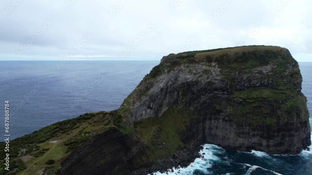 Morro do Castelo Branco connected with Faial island by isthmus, Azores. Aerial reveal Morro do Castelo Branco connected with Faial island by isthmus, Azores. Aerial reveal