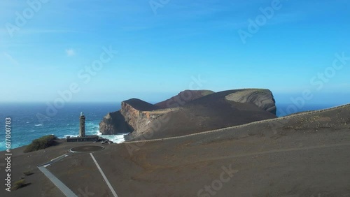 Faial Island covered with ashes from Capelinhos Volcano, Azores. Aerial, ascend photo