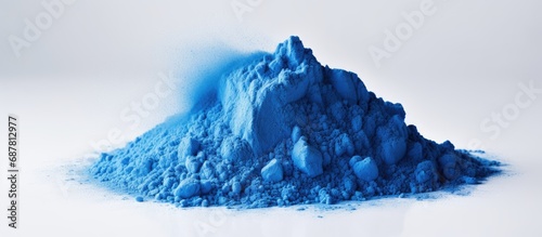 Blue carbon powder for painting on a white surface. photo