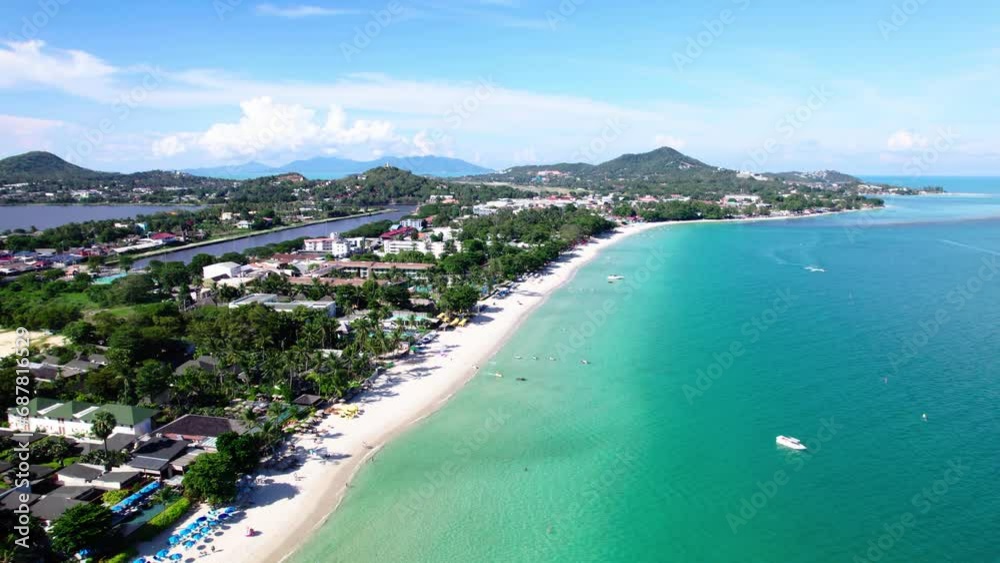 Drone dives down towards Chaweng beach, Koh Samui. Drone dives down towards Chaweng beach, Koh Samui.
