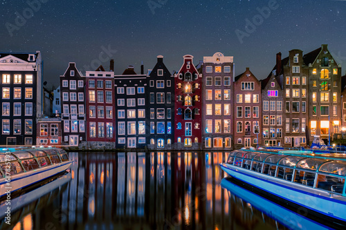 Photography Amsterdam Netherlands canals with lights during evening in December during winte