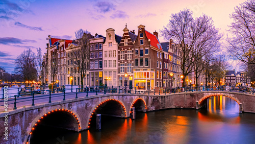 Amsterdam Netherlands canals with lights during evening in December during winter in the Netherlands photo