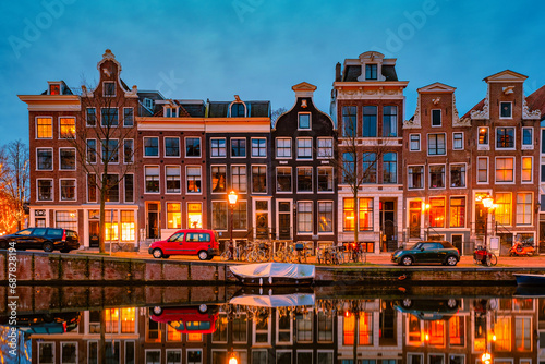 Amsterdam Netherlands canals with lights during evening in December during winter in the Netherlands photo