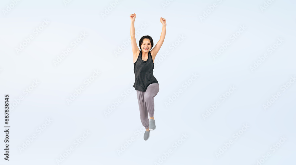ジャンプするスポーツウェアを着た女性　切り抜き全身写真（切り抜き背景透過PNGも販売しております。作成者リンクから「PNG」で検索してください）