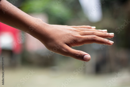 A man showing five fingers of his hand and blurred background © Rokonuzzamnan