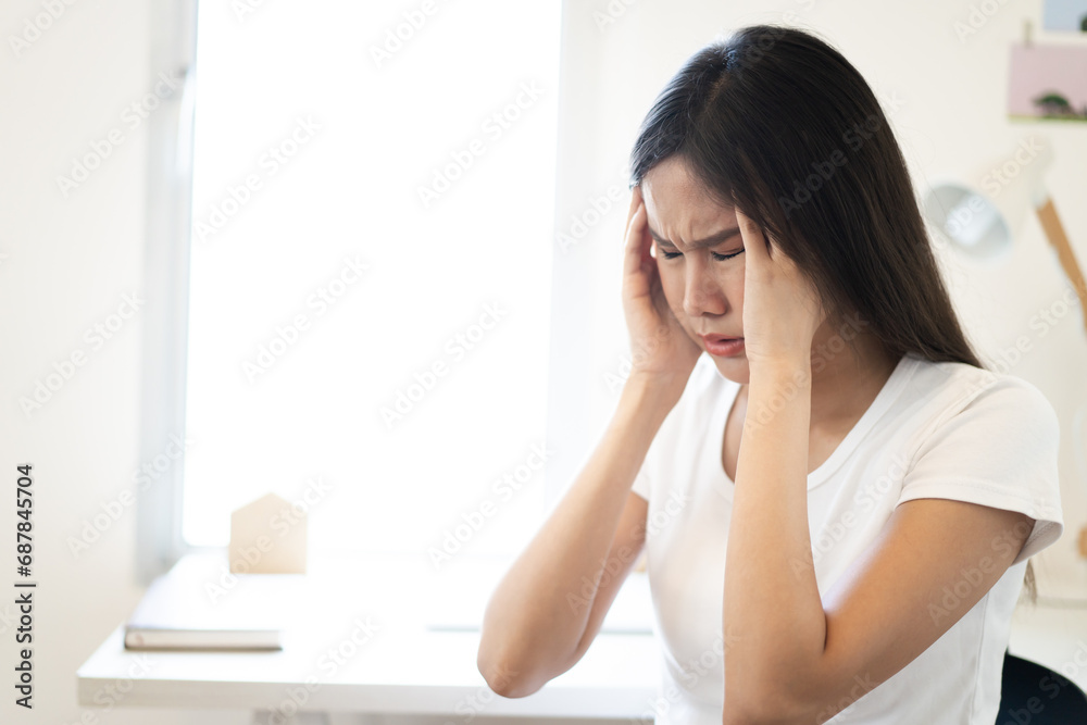 Unhappy - stressful Asian young woman having a depression disease. Unhappy - stressful Asian young woman having a depression disease.