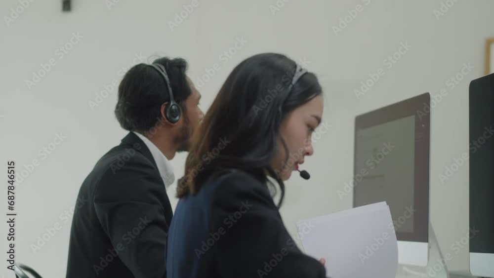 Reception secretary answering client phone call at customer service, helping people at call center support. Male receptionist giving telemarketing assistance on phone helpline in office. Reception secretary answering client phone call at customer service, helping people at call center support. Male receptionist giving telemarketing assistance on phone helpline in office.