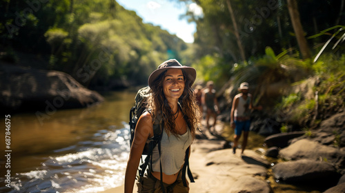 smiling woman in hat with backpack walks by river, outdoor joy, fictional location
