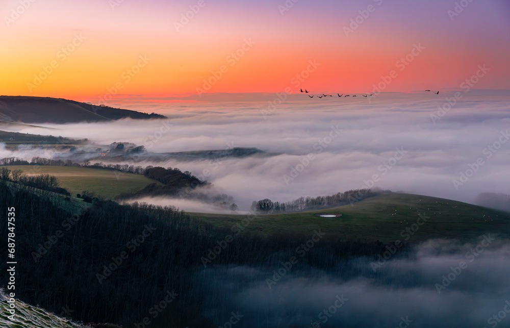 Winter sunset cloud inversion from Butts Brow on the south downs Eastbourne south east England UK