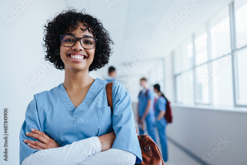 Young nursing student starting an internship in a hospital photo