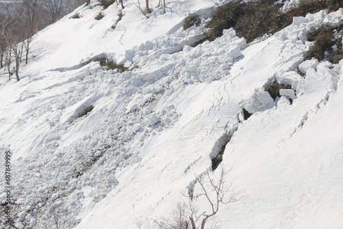 Large avalanche crack in snow on mountain in spring © Alexandra Scotcher