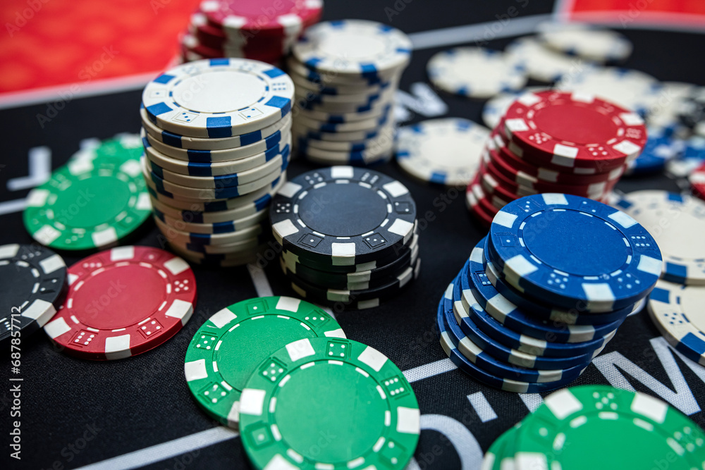 Stack of poker chips at casino black table background. Stack of poker chips at casino black table background.