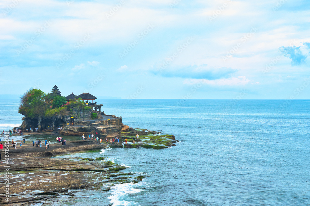 BALI, INDONESIA - CIRCA NOVEMBER 19, 2023 Tanah Lot Temple, an important Hindu temple located on a rock offshore in South Bali, NOVEMBER 19, 2023 Indonesia. This was during the wet season.