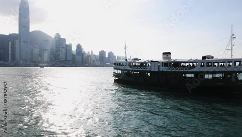 Hong Kong-November 16, 2023- The start ferry is Tsim Sha Tsui to Wan Chai Ferry and Central ferry terminal pier is a favourite way to cross from Kowloon side to Hong Kong. Best view of the city.   photo