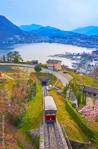Monte Bre funicular on the mountain slope against the Lake Lugano, Albonago village, Ticino, Switzerland