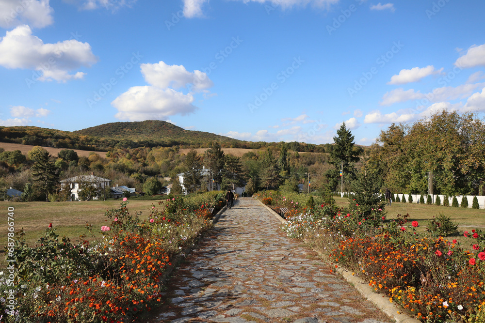 old woman in a monastery garden