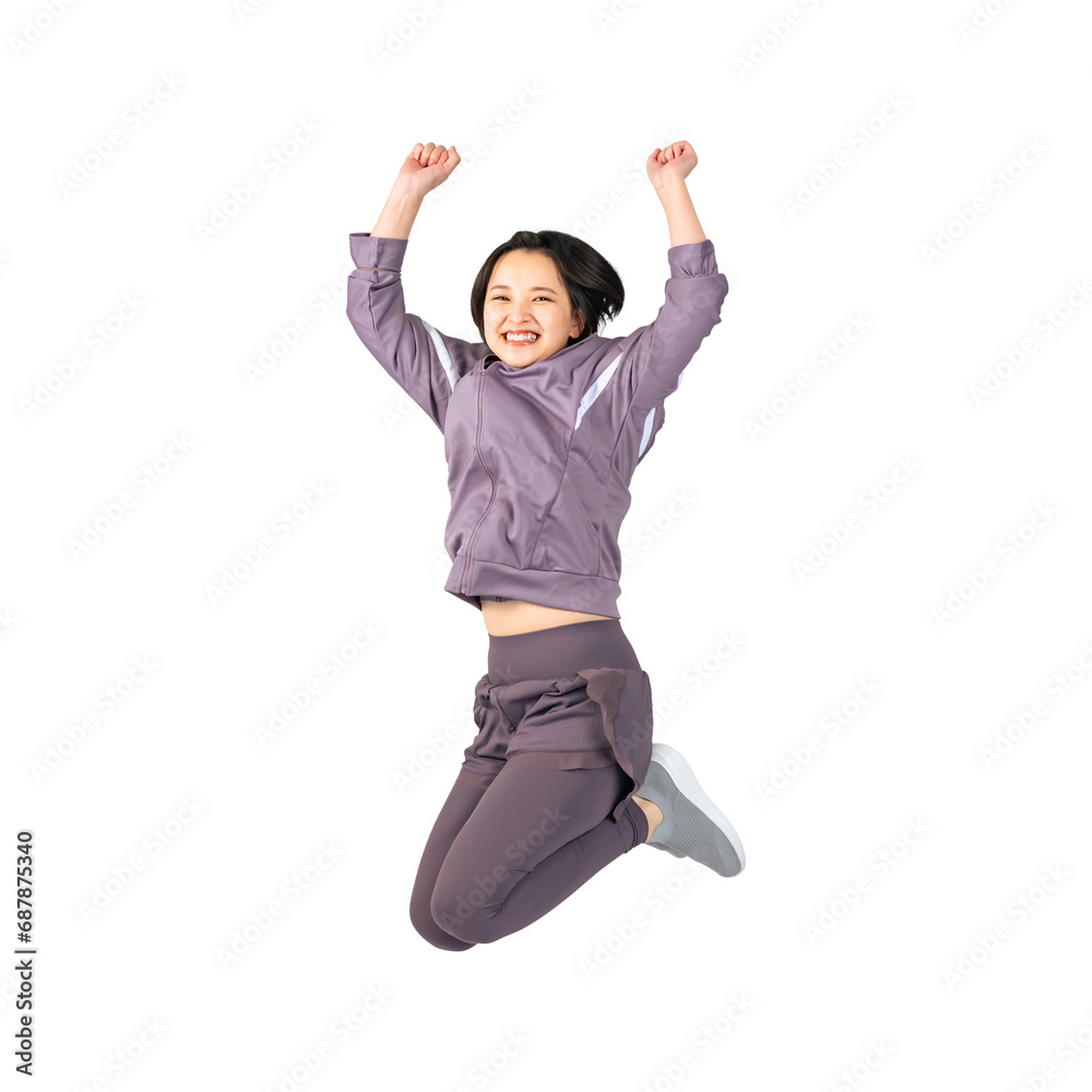 ジャンプするスポーツウェアを着た女性　切り抜き全身写真