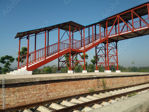 Metallic footover bridge at railway station photo